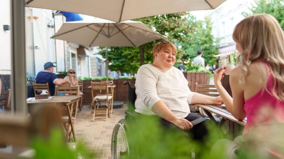 Restaurant patio seating shaded with commercial umbrellas
