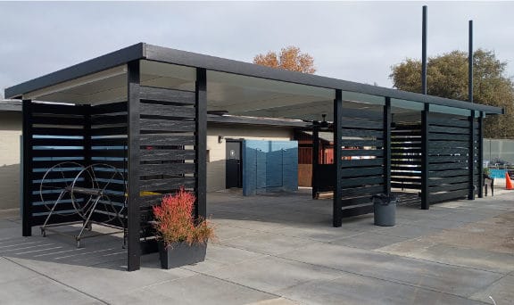 New patio cover with cieling fans used for shade poolside